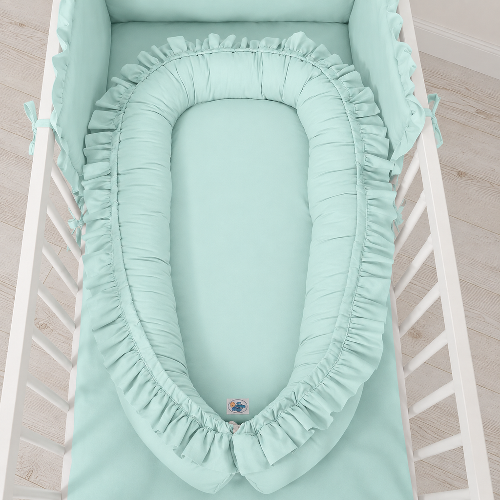 Babynestchen mit Rüschen – Sanfte Farbtöne