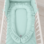 Babynestchen mit Rüschen – Sanfte Farbtöne